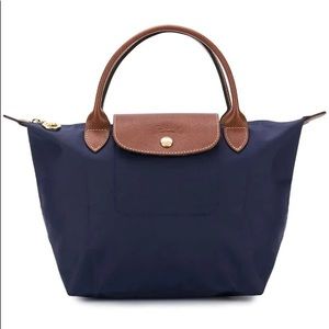 Brand new. Never used. Longchamp bag. Small